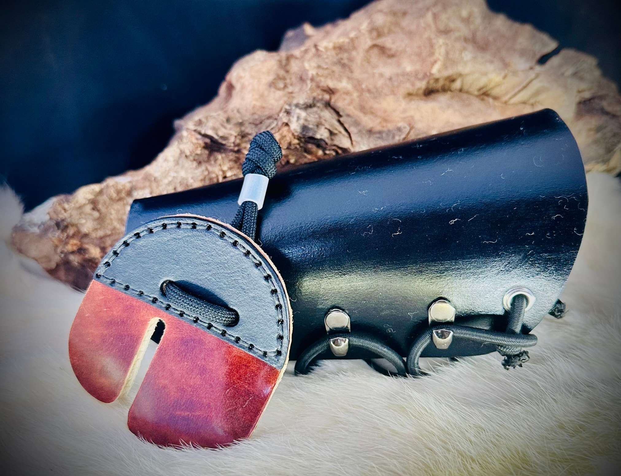 Matching black leather archery tab and bracer set with silver buckle fastenings